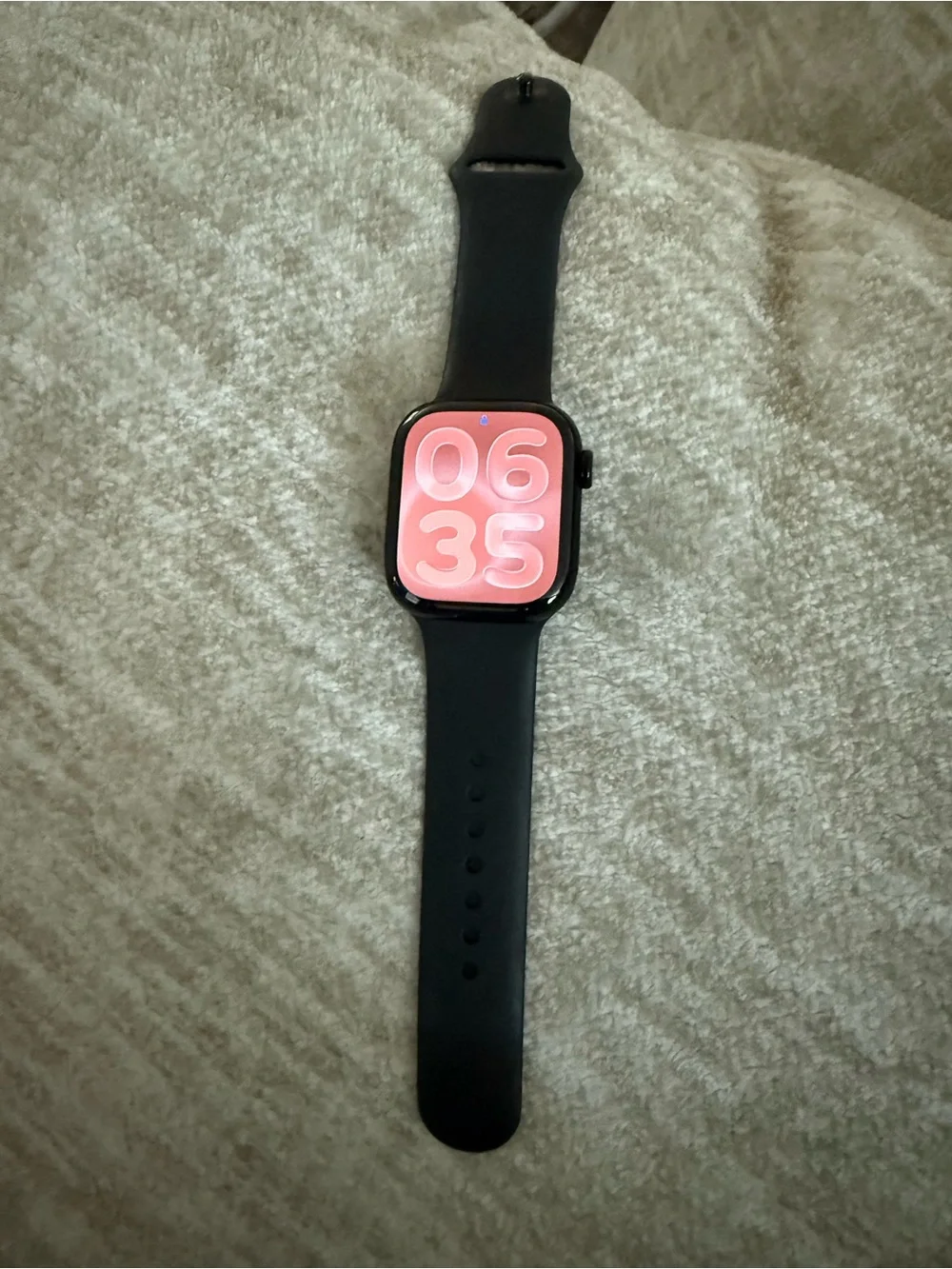 Apple Watch Series 11. GPS. 44mm Jet black aluminum case with black sport band.